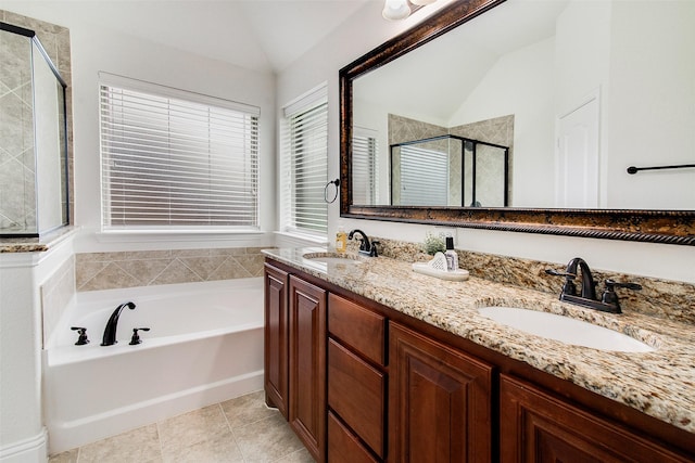 bathroom with tile patterned flooring, vanity, lofted ceiling, and shower with separate bathtub