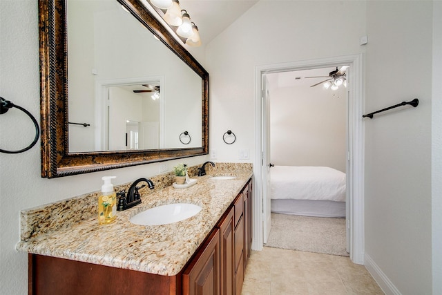 bathroom with lofted ceiling, vanity, and ceiling fan