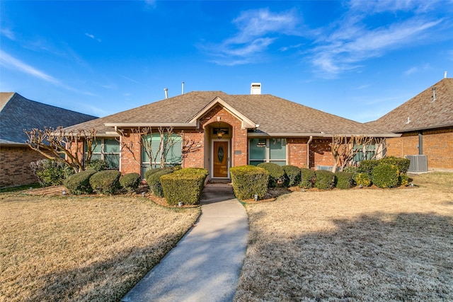 ranch-style home featuring a front lawn