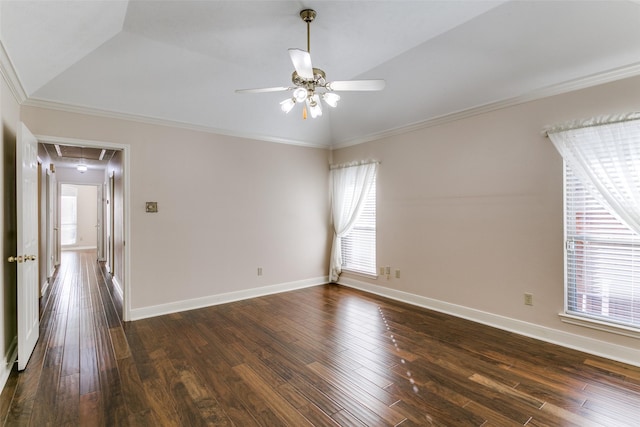 spare room featuring dark hardwood / wood-style flooring, crown molding, vaulted ceiling, and ceiling fan