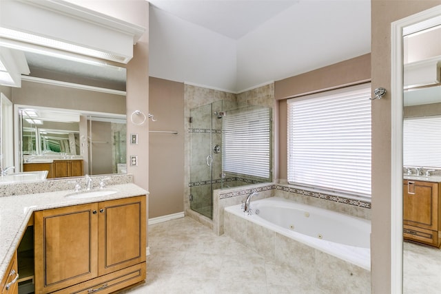 bathroom featuring vanity, tile patterned flooring, and shower with separate bathtub