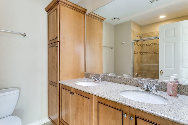 bathroom featuring walk in shower, vanity, and toilet