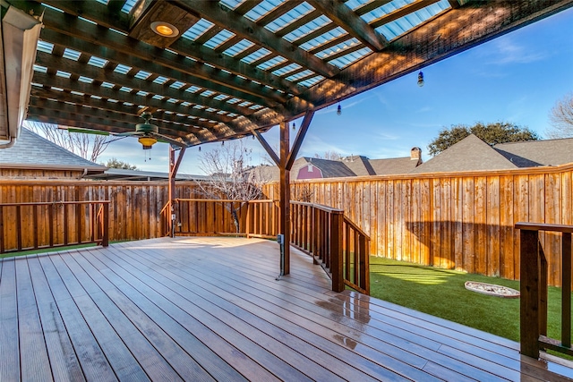 wooden deck with a pergola and a lawn