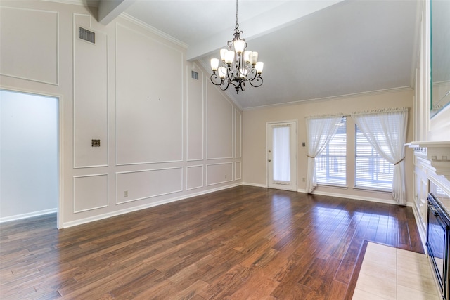 interior space featuring crown molding, dark hardwood / wood-style flooring, lofted ceiling with beams, and a notable chandelier