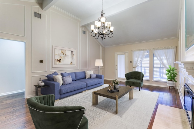 living room with a notable chandelier, crown molding, dark hardwood / wood-style floors, and beamed ceiling