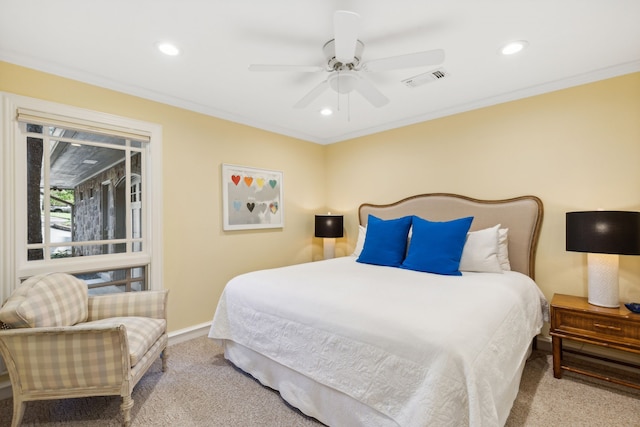 bedroom with crown molding, light colored carpet, and ceiling fan