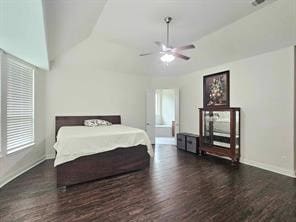 bedroom with dark hardwood / wood-style flooring, lofted ceiling, and ceiling fan