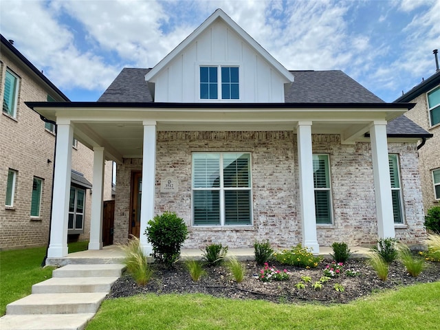 3512 Pritchard Rd, Celina, TX 75009 - view of front of property featuring covered porch, board and batten siding, brick siding, and a shingled roof