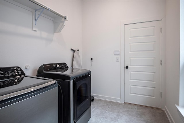 3512 Pritchard Rd, Celina, TX 75009 - laundry room featuring washing machine and clothes dryer, baseboards, and light tile patterned floors