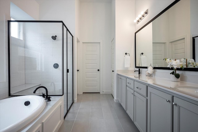 3512 Pritchard Rd, Celina, TX 75009 - bathroom with a stall shower, double vanity, a bath, tile patterned flooring, and a towering ceiling