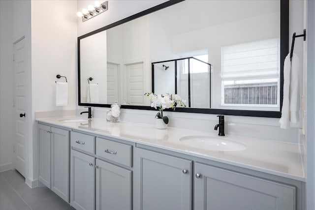 3512 Pritchard Rd, Celina, TX 75009 - bathroom with double vanity, a shower stall, and tile patterned floors