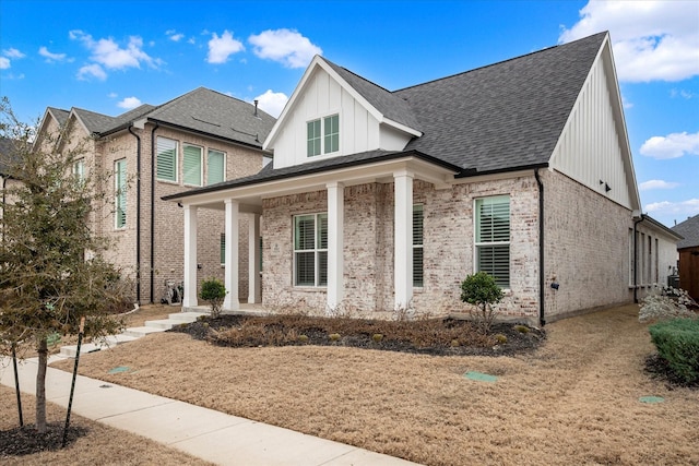 3512 Pritchard Rd, Celina, TX 75009 - view of front facade with brick siding, a porch, board and batten siding, and a shingled roof