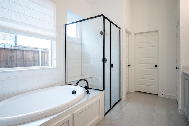 bathroom with vanity, tile patterned floors, and independent shower and bath