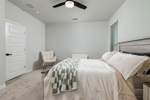 bedroom with baseboards, carpet, visible vents, and a ceiling fan