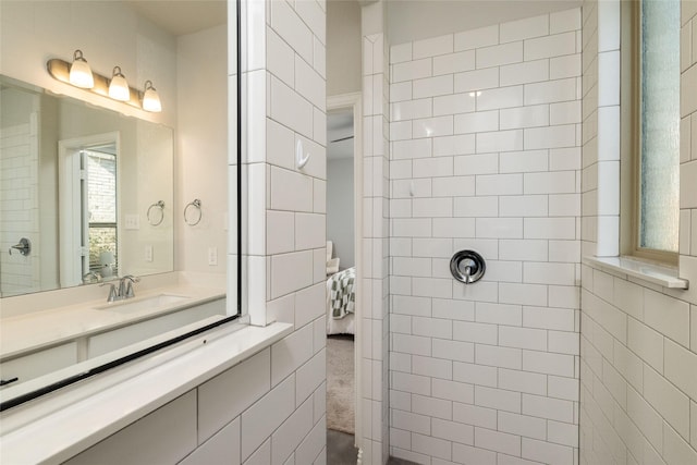 bathroom featuring vanity and a walk in shower