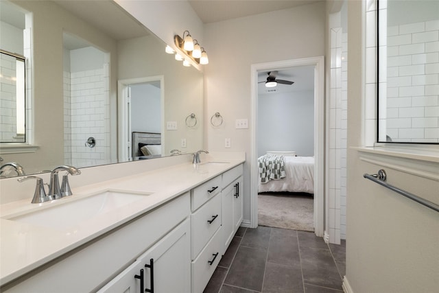 bathroom with ceiling fan, tile patterned floors, and vanity