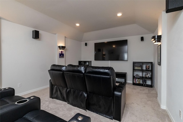 cinema featuring lofted ceiling and light colored carpet