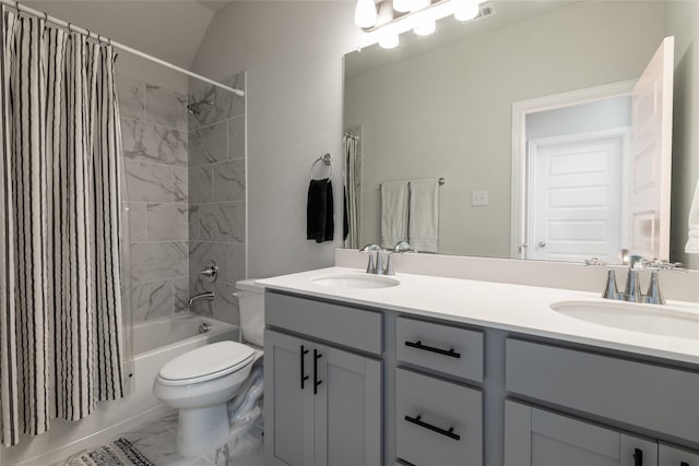 full bath with toilet, marble finish floor, shower / bathtub combination with curtain, and a sink