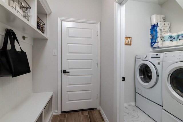 washroom with washing machine and dryer