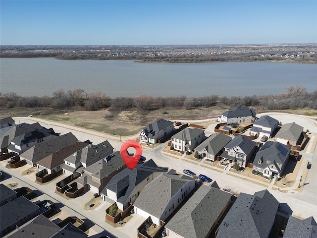 aerial view with a water view and a residential view