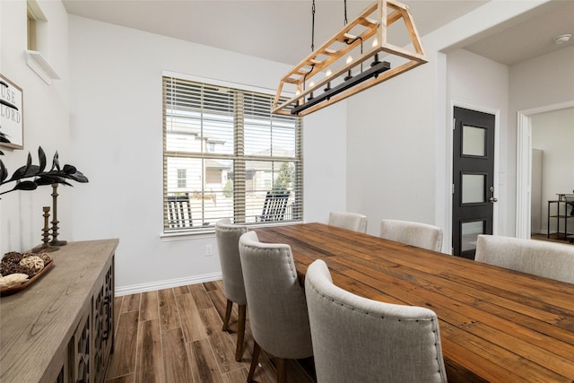 dining area with dark wood-type flooring