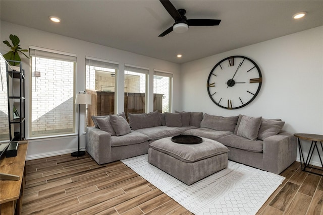 living area with baseboards, recessed lighting, a ceiling fan, and wood tiled floor