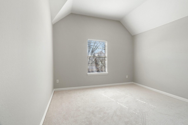 bonus room featuring lofted ceiling and carpet floors