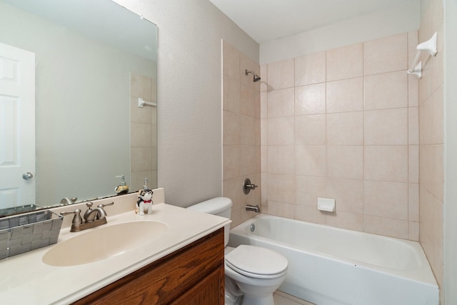 full bathroom with vanity, toilet, and tiled shower / bath combo