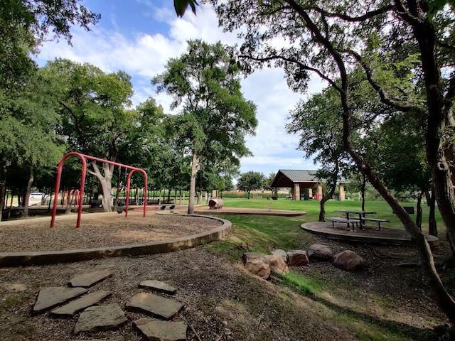 view of jungle gym with a lawn