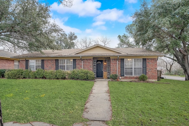 ranch-style home featuring a front yard