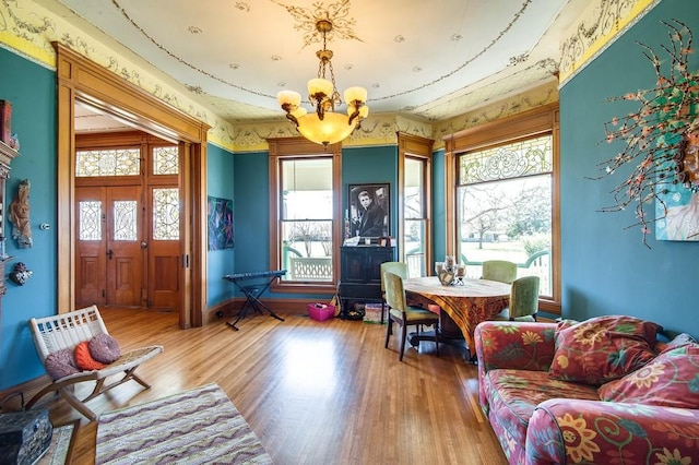 interior space with hardwood / wood-style floors and a notable chandelier