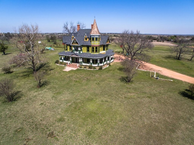 birds eye view of property featuring a rural view