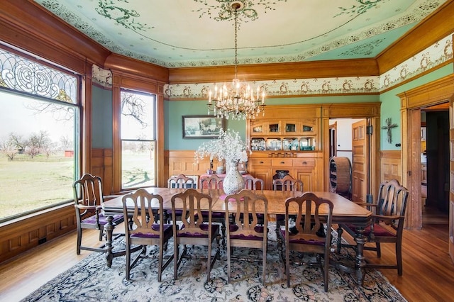 dining room featuring hardwood / wood-style floors and a notable chandelier