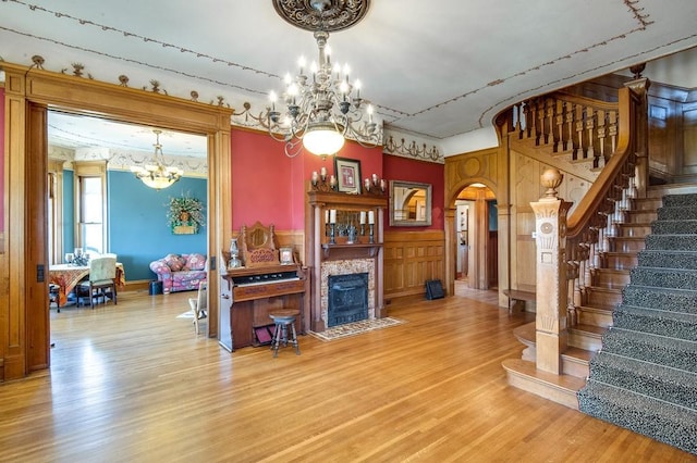 interior space featuring an inviting chandelier and hardwood / wood-style floors