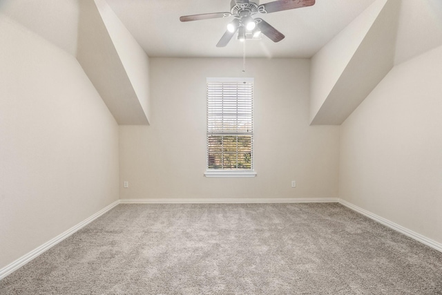 bonus room with vaulted ceiling, ceiling fan, and carpet