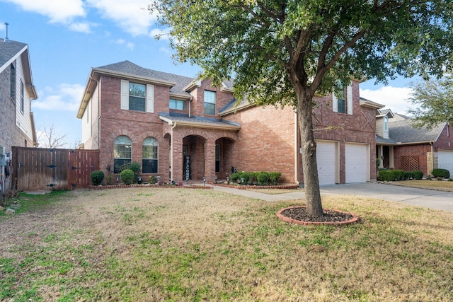 view of front facade with a garage and a front lawn