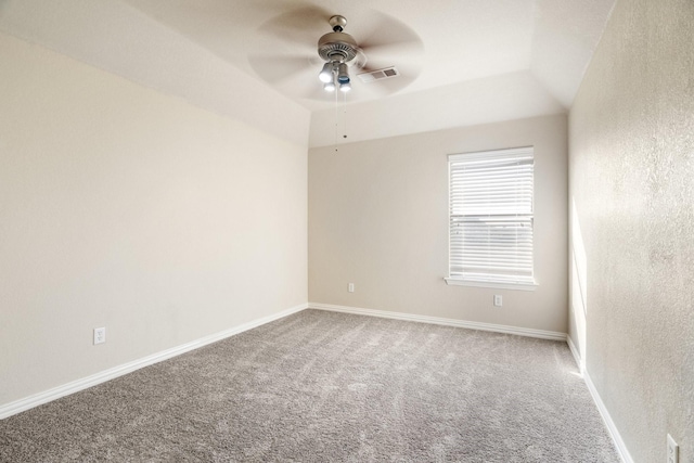 spare room with carpet floors, ceiling fan, and vaulted ceiling