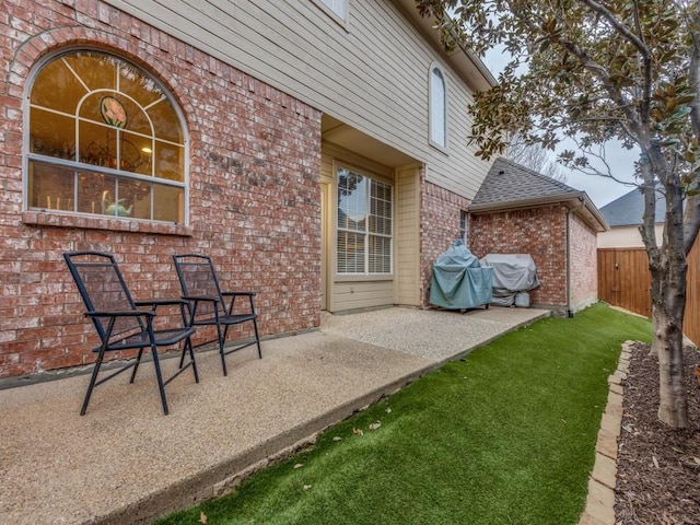 view of patio featuring fence