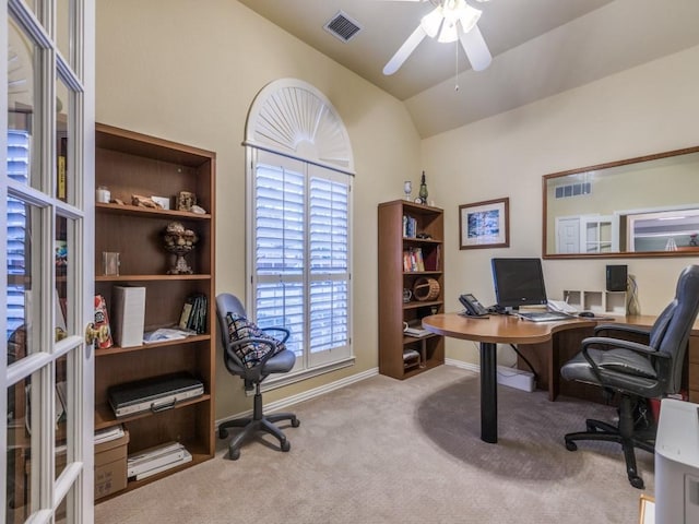 home office with lofted ceiling, baseboards, visible vents, and carpet flooring