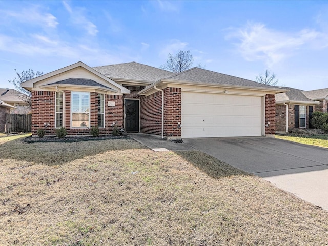 ranch-style home with a garage and a front lawn