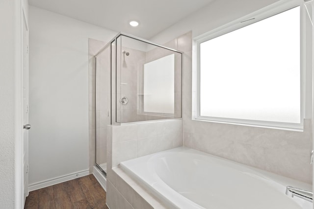 2413 Dahlia Dr, Fort Worth, TX 76123 - full bath featuring a stall shower, a garden tub, wood finished floors, and recessed lighting