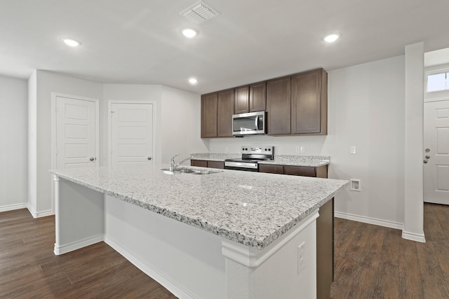 2413 Dahlia Dr, Fort Worth, TX 76123 - kitchen with appliances with stainless steel finishes, baseboards, a sink, dark wood-style flooring, and recessed lighting