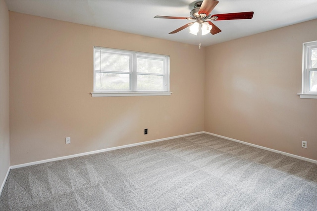 empty room featuring ceiling fan and carpet floors