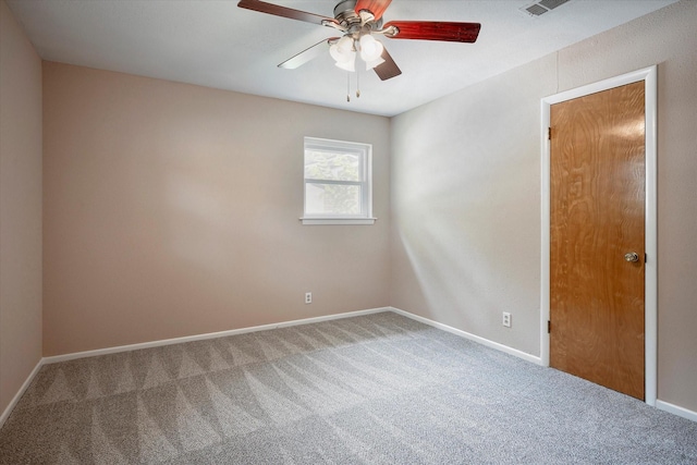 empty room featuring carpet floors and ceiling fan