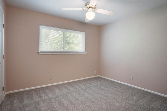 empty room featuring carpet and ceiling fan