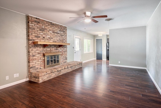 unfurnished living room featuring ceiling fan, a fireplace, and dark hardwood / wood-style flooring