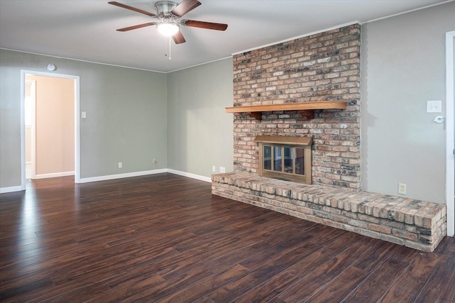 unfurnished living room with ceiling fan, a fireplace, and dark hardwood / wood-style flooring