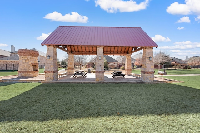 surrounding community featuring a gazebo and a lawn