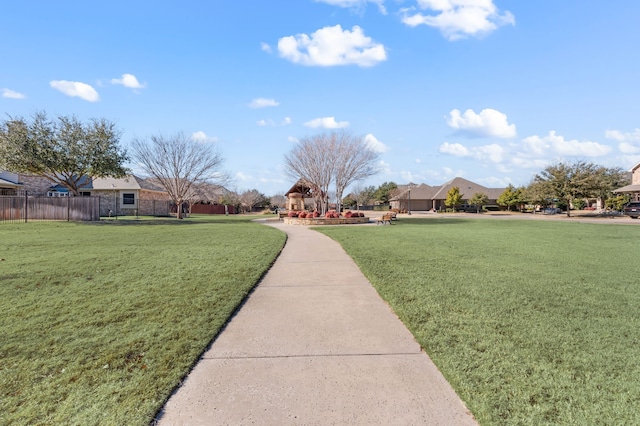 view of home's community with a lawn