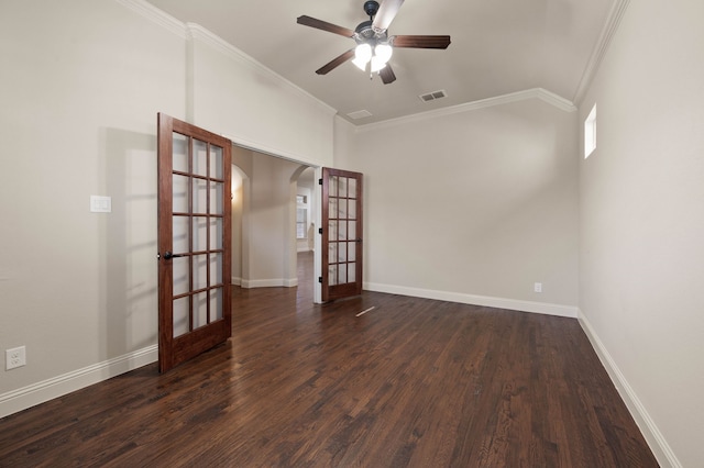 empty room with dark hardwood / wood-style flooring, crown molding, french doors, and ceiling fan